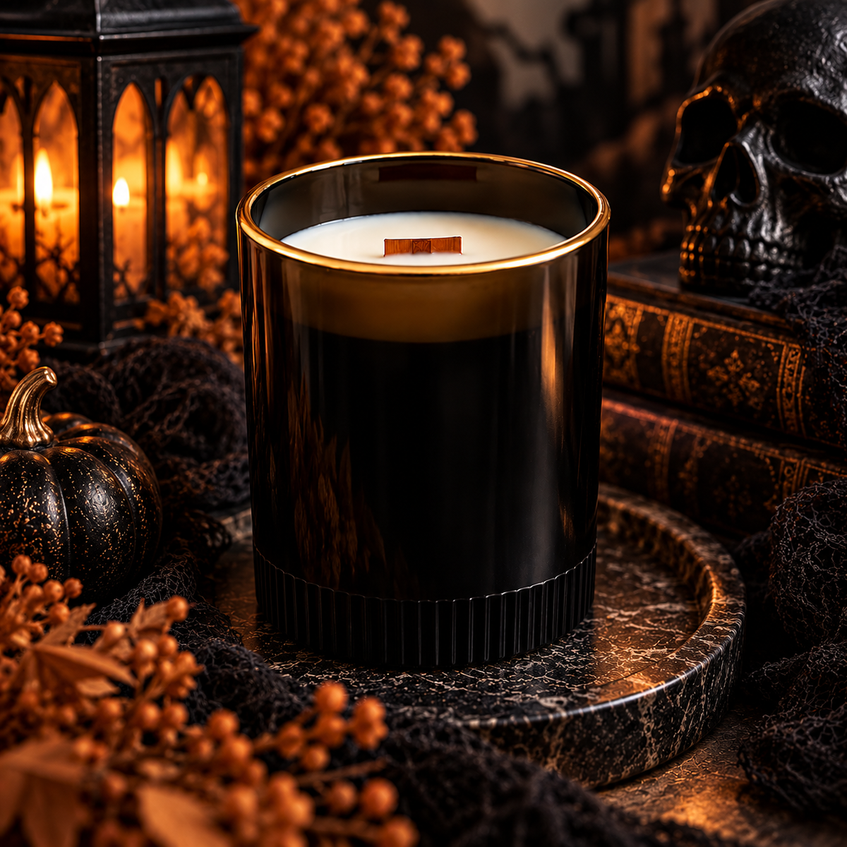 Glossy black ribbed soy candle surrounded by spooky Halloween decor and warm candlelight